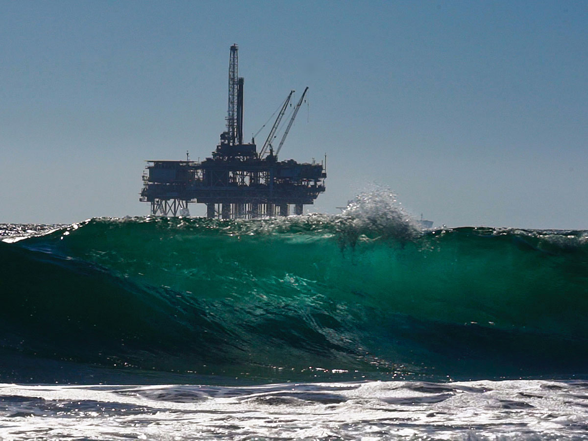 Oil rig set against rough sea background