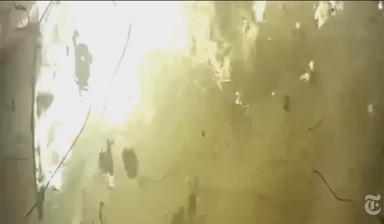 Screen capture of the video from a ground security camera of the moment PS752 impacted the ground and exploded. Fire dominates the screen with pieces of debris seen within.
