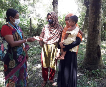 A Bangladeshi community worker providing help