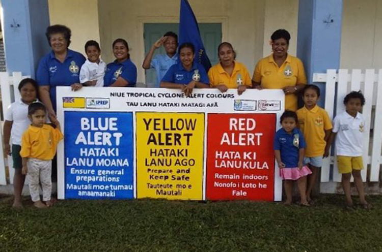 Niue Girls and Boys Brigade educates the public using customised sign boards on cyclone alert levels in their local language in partnership with Niue Met Service