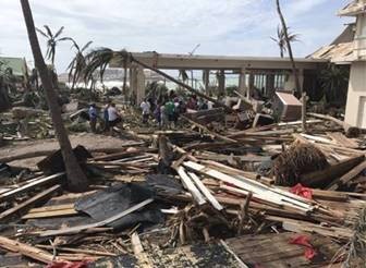 Debris surrounds the entrance of a beach resort after Hurricane Irma (2017).